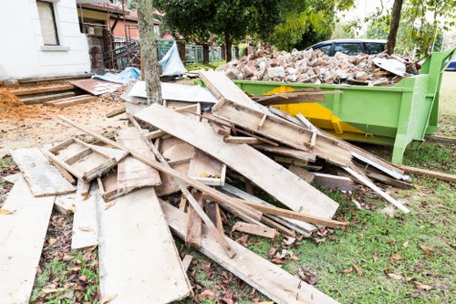 Workers clearing construction debris